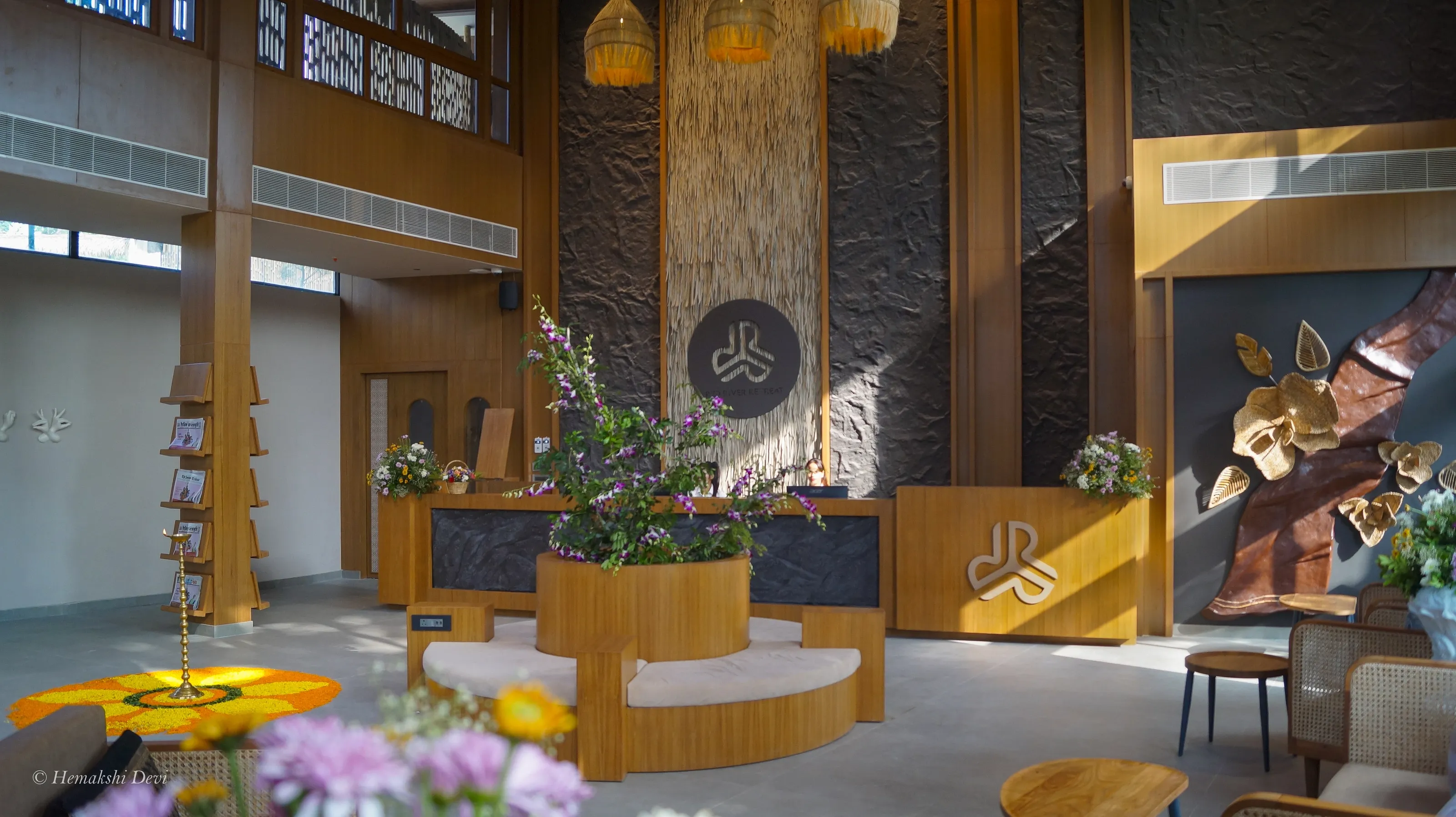 Red River Retreat reception hall, with the large fibre gamosa and cane leaf installation on the right wall